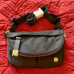 Lululemon Black Crossbody Bag with Gold Accents